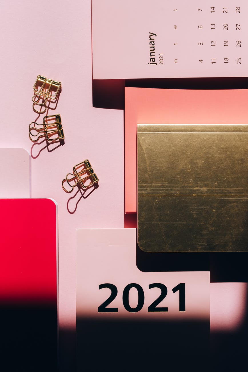 creative composition of modern notebooks and paper clips